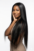 Woman with long, straight black hair against a white background